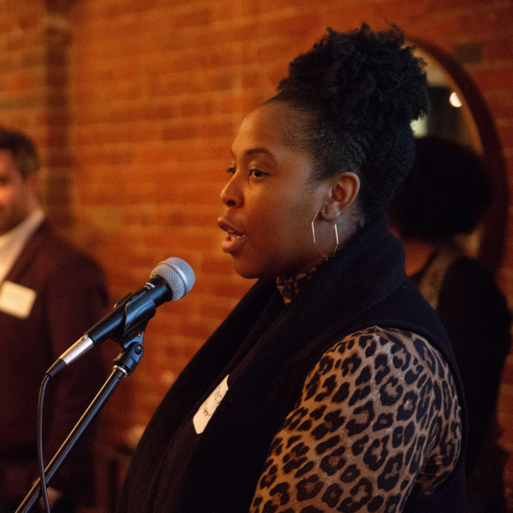 Woman speaking into microphone